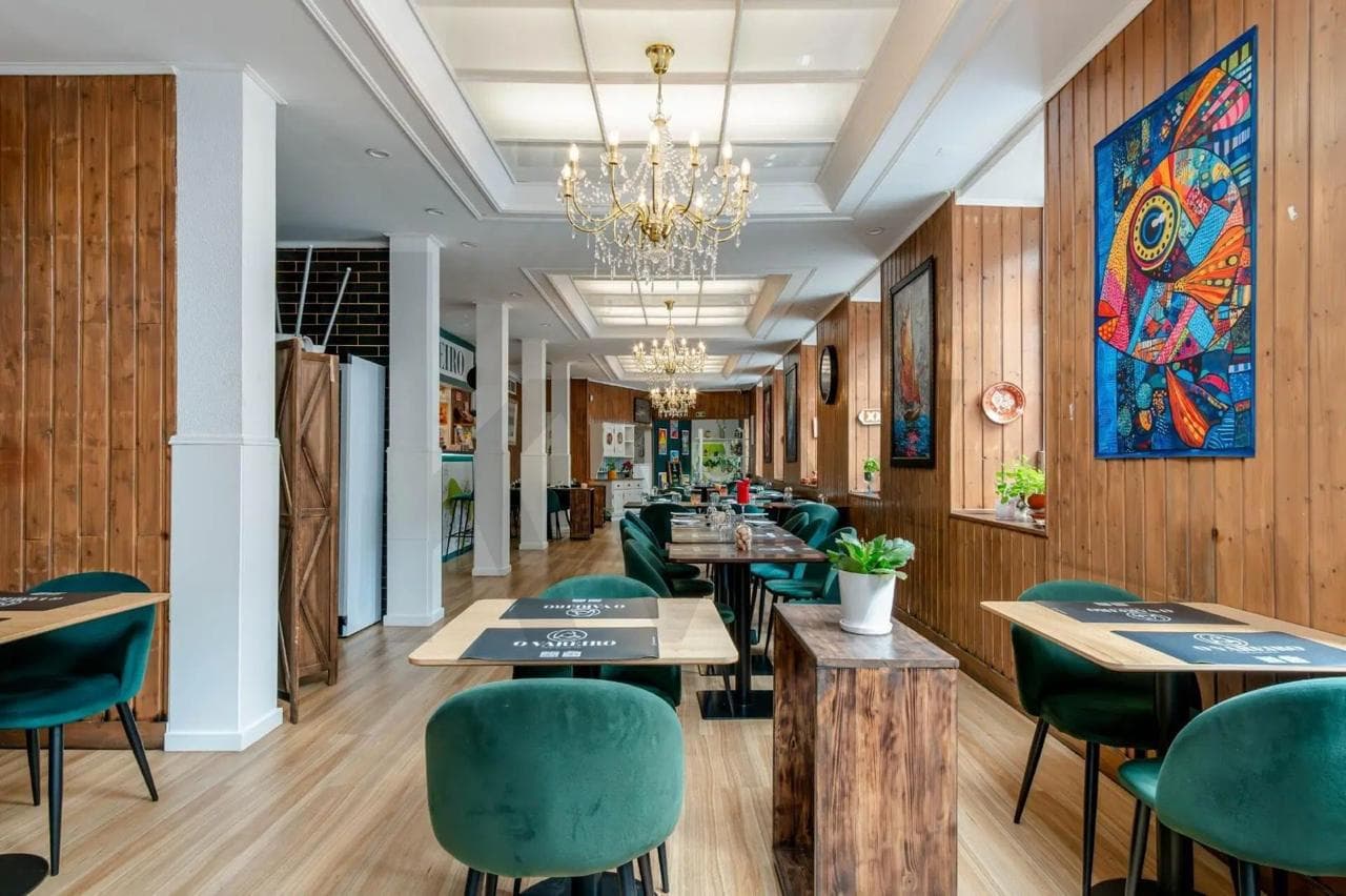 Wood-panelled dining room with contemporary art